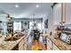 Kitchen with granite countertops, stainless steel sink, and breakfast bar facing the living area at 1709 Creel Ln, Atlanta, GA 30349