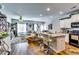 Open floor plan showcasing a living room and kitchen with a breakfast bar and hardwood floors at 1709 Creel Ln, Atlanta, GA 30349