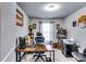 Comfortable home office with a large desk, ergonomic chair, and ample natural light at 1709 Creel Ln, Atlanta, GA 30349