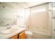 Bright bathroom with white tile, shower and floral wallpaper border at 2410 Deep Shoals Cir, Decatur, GA 30034