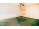 Simple bedroom featuring ceiling fan and a covered window; ready for renovation at 2410 Deep Shoals Cir, Decatur, GA 30034