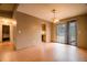 Bright dining area with hardwood floors, slider doors to the back and access to the kitchen at 2410 Deep Shoals Cir, Decatur, GA 30034