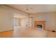 Spacious living room with a classic brick fireplace, hardwood floors and a ceiling fan at 2410 Deep Shoals Cir, Decatur, GA 30034