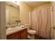Neutral bathroom featuring a vanity with laminate countertops and a shower with a curtain at 284 Southern Trace Way, Rockmart, GA 30153