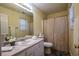 Functional bathroom featuring a vanity with laminate countertops and shower with curtain at 284 Southern Trace Way, Rockmart, GA 30153