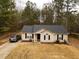 Charming single-story home featuring a well-maintained lawn, dark-shuttered windows, and a private driveway at 284 Southern Trace Way, Rockmart, GA 30153