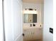 Bathroom with a vanity, framed mirror, modern light fixture, and neutral color palette at 3445 Stratford Ne Rd # 2504, Atlanta, GA 30326