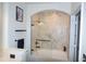 Bathroom showcasing a sleek tub with marble-style tile and a glass shower door at 3445 Stratford Ne Rd # 2504, Atlanta, GA 30326