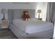 A bedroom features a gray platform bed and side tables with lamps at 3445 Stratford Ne Rd # 2504, Atlanta, GA 30326
