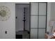 Modern bedroom with sliding door and views into walk-in closet at 3445 Stratford Ne Rd # 2504, Atlanta, GA 30326