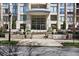 Luxury building entrance with beautiful landscaping and street view at 3445 Stratford Ne Rd # 2504, Atlanta, GA 30326