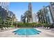 Large in ground community pool with plenty of poolside seating and views of the surrounding high-rise buildings at 3445 Stratford Ne Rd # 2504, Atlanta, GA 30326