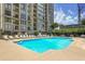 A resort style swimming pool with plenty of lounge chairs for sunbathing, in a high-rise community at 3445 Stratford Ne Rd # 2504, Atlanta, GA 30326