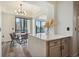 The modern dining area flows into an open living space with stunning views of the city skyline at 3445 Stratford Ne Rd # 2504, Atlanta, GA 30326