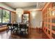 The dining room has wood floors, a view to the outdoors, and a formal dining table with seating for six at 3445 Stratford Ne Rd # 2504, Atlanta, GA 30326