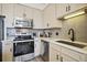 A modern kitchen with stainless steel appliances, quartz countertops, grey subway tile and undermount lighting at 3445 Stratford Ne Rd # 2504, Atlanta, GA 30326