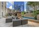 Upscale outdoor living area with cabanas, lounge seating, and water feature at 3445 Stratford Ne Rd # 2504, Atlanta, GA 30326