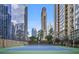 Modern tennis courts with nearby high-rise buildings and lush green landscaping at 3445 Stratford Ne Rd # 2504, Atlanta, GA 30326