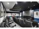 Comfortable theatre room with large projector screen, wall sconces, and movie posters at 3445 Stratford Ne Rd # 2504, Atlanta, GA 30326
