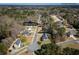 Aerial view of the home in a quiet neighborhood featuring mature trees and manicured lawns at 4638 Arrow Wind Dr, Powder Springs, GA 30127