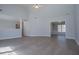 Expansive living room offers hardwood floors, vaulted ceiling, and neutral paint at 4638 Arrow Wind Dr, Powder Springs, GA 30127