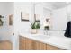Modern bathroom with light wood cabinets, quartz counters, and stylish fixtures at 567 Ponce De Leon Ne Ave # 404, Atlanta, GA 30308