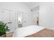 Serene bedroom with contemporary decor featuring mirrored accent, and white linens at 567 Ponce De Leon Ne Ave # 404, Atlanta, GA 30308