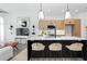Contemporary kitchen boasts a large island with seating and flows seamlessly into the living area at 567 Ponce De Leon Ne Ave # 404, Atlanta, GA 30308