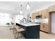 Modern kitchen featuring a large island with seating and stainless steel appliances at 567 Ponce De Leon Ne Ave # 404, Atlanta, GA 30308