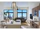 Bright open-concept kitchen featuring a quartz island, stainless appliances, and expansive windows with a city view at 567 Ponce De Leon Ne Ave # 404, Atlanta, GA 30308