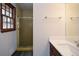 This bathroom features a single sink vanity with laminate countertop and walk-in shower at 4800 Timber Ridge Dr, Douglasville, GA 30135