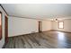 Open living room with new flooring, neutral walls, and ceiling fan, ready for your personal touch at 4800 Timber Ridge Dr, Douglasville, GA 30135