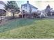 Expansive backyard with lush lawn, deck, and fence, perfect for outdoor activities at 1009 Fairway Seven, Villa Rica, GA 30180