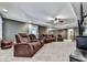 Finished basement featuring comfortable reclining furniture and large television at 1009 Fairway Seven, Villa Rica, GA 30180
