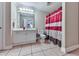 Clean bathroom with vanity, white cabinets, and a striped shower curtain at 1009 Fairway Seven, Villa Rica, GA 30180