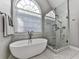 Bright bathroom featuring a soaking tub and glass shower at 1009 Fairway Seven, Villa Rica, GA 30180