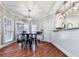 Bright breakfast nook featuring a dining table, shiplap accents, and many windows at 1009 Fairway Seven, Villa Rica, GA 30180