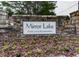 Charming stone entrance sign to Mirror Lake, highlighting a lake and golf community at 1009 Fairway Seven, Villa Rica, GA 30180