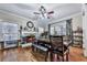 Charming dining room with hardwood floors, a fireplace, a large window, and seating for six at 1009 Fairway Seven, Villa Rica, GA 30180