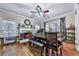 Dining room featuring a fireplace, large windows, and a wooden dining table at 1009 Fairway Seven, Villa Rica, GA 30180