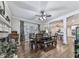 Elegant dining room with a fireplace, stylish table, and views of the backyard at 1009 Fairway Seven, Villa Rica, GA 30180