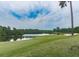 Scenic view of a lush golf course and serene lake, enhancing the community's natural beauty at 1009 Fairway Seven, Villa Rica, GA 30180
