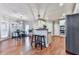 Open kitchen with a center island, stainless steel appliances, and an adjacent dining area at 1009 Fairway Seven, Villa Rica, GA 30180