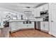 Open kitchen with stainless steel appliances and view into the dining room at 1009 Fairway Seven, Villa Rica, GA 30180
