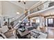 Spacious living area featuring a cozy seating arrangement, high ceilings, and staircase at 1009 Fairway Seven, Villa Rica, GA 30180