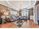 Comfortable living room featuring stylish furniture, large windows, and hardwood floors at 1009 Fairway Seven, Villa Rica, GA 30180