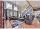 Bright and airy living room with high ceilings, fireplace, and staircase at 1009 Fairway Seven, Villa Rica, GA 30180