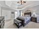 Spacious bedroom boasting tray ceilings, carpet, and matching furnishings at 1009 Fairway Seven, Villa Rica, GA 30180