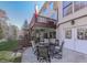 Spacious outdoor patio with dining area and staircase, offering beautiful backyard views at 1009 Fairway Seven, Villa Rica, GA 30180