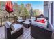 Outdoor patio with wicker furniture, offering a cozy space for relaxation with lush greenery in the background at 1009 Fairway Seven, Villa Rica, GA 30180